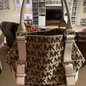 Genuine Michael Kors shoulder bag-worn twice.Measures 12in w x 9in h.Must have!